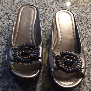 Pewter platform sandals flower embellishment.